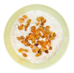 oat porridge with raisins in ceramic bowl
