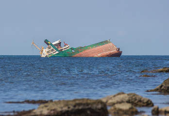 Sunk ship in blue water