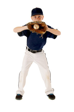 Young Baseball Player Catching Ball