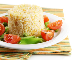 Delicious risotto with vegetables isolated on white