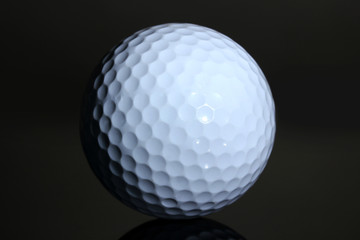 Golf ball on grey background