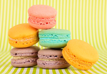Gentle macaroons on green background