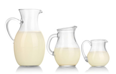 Milk in jugs isolated on white