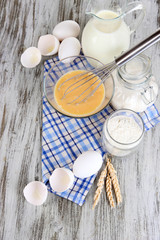 Ingredients for dough on wooden table close-up