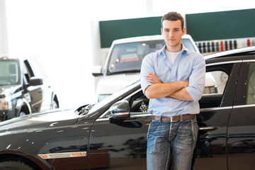 Fototapeta na wymiar man standing near a car