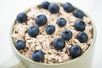Cereals with ripe blueberries, horizontal shot, close-up