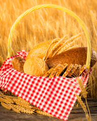 Fototapeta na wymiar Homemade bread and wheat on the wooden table