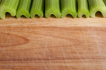 Celery stalks against wood