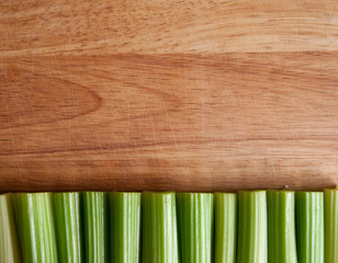 Celery stalks against wood