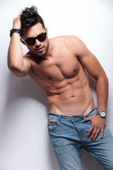 Fototapeta premium topless young man with hand in hair