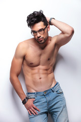 Fototapeta premium topless young man with hand behind head