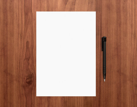 Blank paper with pen on desk
