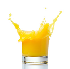 Naklejka na ściany i meble Orange juice splash on a white background.