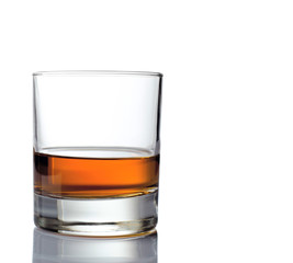 Glass of whiskey solated on white background