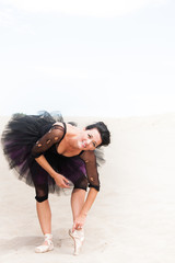 Ballerina bending and stretching © amyinlondon