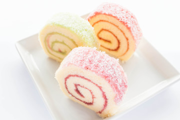 Colorful jam roll cakes  on the dish