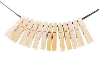 Clothespins and rope on a white background