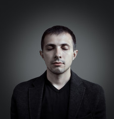 Fototapeta premium Man in jacket is meditating