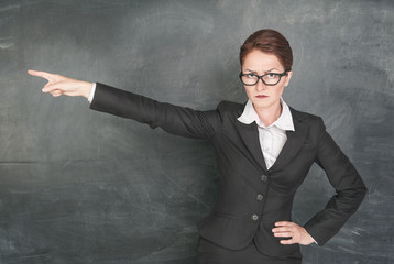 Angry teacher pointing out