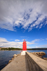Small Lighthouse near the sea on a dock in Krk Island, Croatia