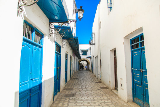 Tunis streets with traditional white and black painted buildings