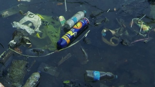 Dirty plastic bottle rubbish in water