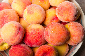 Bowl of fresh yellow peaches