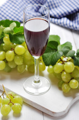 Red wine and grapes
