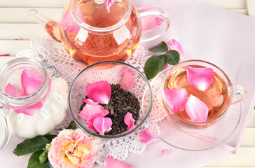 Kettle and cup of tea from tea rose