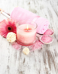 Fototapeta na wymiar Beautiful spa setting with pink candle and flower