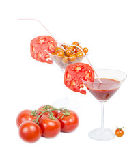 Tomato juice in the glass, orange cherry tomatoes and red tomato