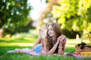 Beautiful girl on a picnic in park