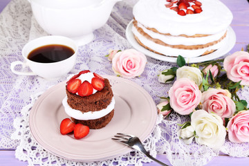 Chocolate cake with strawberry on wooden table close-up