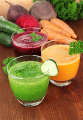 Fresh vegetable juices on table close-up