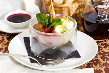 Caprese tomato and cheese on the table in a restaurant