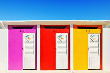 Brightly coloured beach huts in Rimini