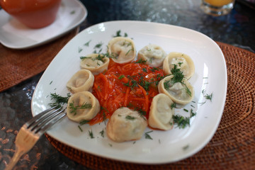 Meat dumplings with vegetable salsa