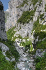 A group of tourists in canyon Verdon during canyoning