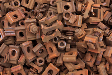 Rusty train track nuts, bolts, washers and clasps