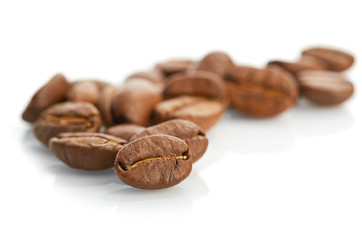 Macro of coffee beans isolated on white background