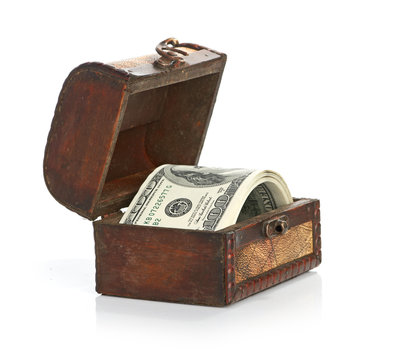 Dollar-bills in the old wooden treasure chest