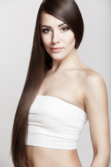 Fototapeta premium beautiful young brunette woman with long hair