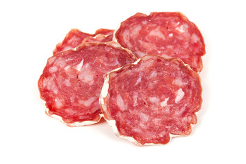 Obraz premium pile of salchichon, red spanish salami, on a white