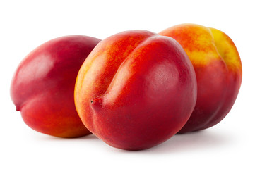 Three juicy nectarine isolated on white background