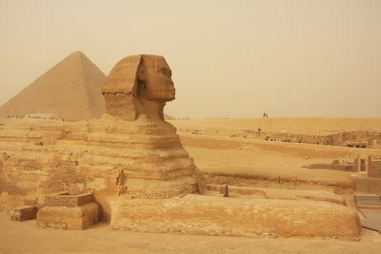 The Sphinx and Great Pyramid of Khufu in a sand storm, Cairo