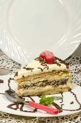 Slice of homemade nutty cake with strawberries