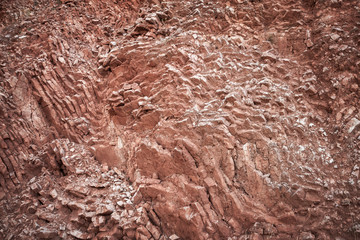 Red rocks background texture. Coast of Adriatic Sea, Montenegro