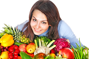 Woman with group of fruit and vegetables.