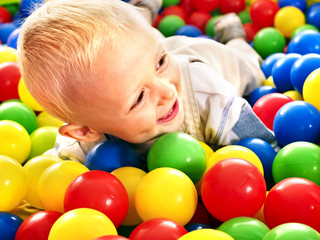 Child in colored ball.
