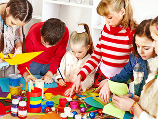 Child painting at art school.